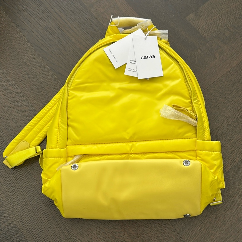 Caraa yellow backpack with luggage sleeve. New